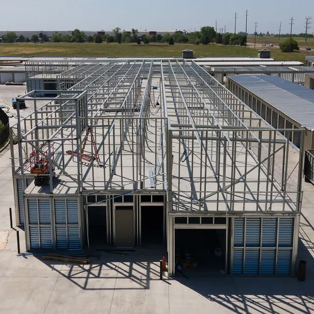 Steel-frame self-storage building under construction during a ground-up development project